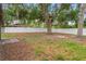 Private backyard with trees and white fencing at 22 Hillcrest Dr, Babson Park, FL 33827