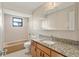 Cozy bathroom featuring tile flooring, granite countertops and bathtub with shower and natural light at 22 Hillcrest Dr, Babson Park, FL 33827