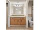 Bathroom featuring a granite countertop vanity, a large mirror, and a tiled floor at 22 Hillcrest Dr, Babson Park, FL 33827