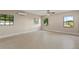 Large bedroom with windows and tiled flooring at 22 Hillcrest Dr, Babson Park, FL 33827