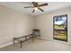 Light and airy bedroom with neutral walls, tile flooring and ceiling fan with natural light at 22 Hillcrest Dr, Babson Park, FL 33827