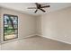 Bright bedroom with neutral walls, tile flooring and natural light coming through the window at 22 Hillcrest Dr, Babson Park, FL 33827