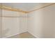 Walk-in closet features built-in wood shelving for easy organization at 22 Hillcrest Dr, Babson Park, FL 33827
