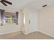 Welcoming tiled entry featuring a new door and a window at 22 Hillcrest Dr, Babson Park, FL 33827