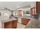 Charming kitchen featuring granite countertops, modern backsplash, and stainless steel appliances at 22 Hillcrest Dr, Babson Park, FL 33827