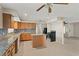 Well-lit kitchen with island, white appliances, and lots of counter space at 22 Hillcrest Dr, Babson Park, FL 33827