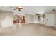 Open living space with tiled flooring and a view of the kitchen at 22 Hillcrest Dr, Babson Park, FL 33827