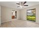 Primary bedroom with tile flooring and a bathroom featuring a granite countertop and tile flooring at 22 Hillcrest Dr, Babson Park, FL 33827