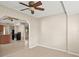 Bright room featuring tile floors and an open floor plan, adjacent to the kitchen at 22 Hillcrest Dr, Babson Park, FL 33827