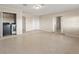 Open room with tile flooring, washer/dryer hookups, and access to other rooms of the home at 22 Hillcrest Dr, Babson Park, FL 33827