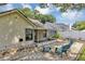 Spacious backyard featuring an outdoor patio and seating area, and screened-in porch at 2227 Doulton Dr, Orlando, FL 32812