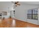 Bright living room with wood floors, vaulted ceiling, and many windows allowing natural light at 2227 Doulton Dr, Orlando, FL 32812