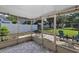 The covered screened patio features outdoor seating, overhead lighting, and pavers at 2227 Doulton Dr, Orlando, FL 32812