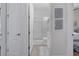 This is a bathroom with a shower and a doorway looking into another room at 2233 Antilles Club Dr, Kissimmee, FL 34747