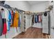 This spacious walk-in closet offers ample storage, wire shelving, and warm wood floors at 2233 Antilles Club Dr, Kissimmee, FL 34747