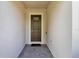 Inviting front door with decorative glass and a stylish 'Hello' doormat at 2233 Antilles Club Dr, Kissimmee, FL 34747