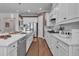 Modern kitchen features large island, stainless steel appliances, and sleek countertops at 2233 Antilles Club Dr, Kissimmee, FL 34747