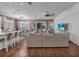 Open-concept living space boasts a kitchen island with barstool seating and leads to a living room at 2233 Antilles Club Dr, Kissimmee, FL 34747