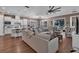 Open-concept living space boasts a kitchen island with barstool seating and leads to a living room at 2233 Antilles Club Dr, Kissimmee, FL 34747