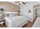 Cozy main bedroom boasts a decorative headboard, warm wood floors, and a calm color palette at 2233 Antilles Club Dr, Kissimmee, FL 34747