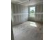 Bright, unfinished bedroom with a window offering great natural light during the construction phase at 2365 Zuni Road, St Cloud, FL 34771