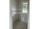 Unfinished walk-in closet with natural light from the window; ready for customization at 2365 Zuni Road, St Cloud, FL 34771