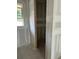 Empty walk-in closet with a window and an open doorway, awaiting personal touches at 2365 Zuni Road, St Cloud, FL 34771