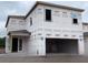 New two-story home under construction with a spacious garage and modern architectural design at 2365 Zuni Road, St Cloud, FL 34771