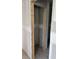 Hallway with open doorway offers sightline to rooms further into the home at 2365 Zuni Road, St Cloud, FL 34771
