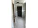 Hallway with open doorway offers sightline to rooms further into the home at 2365 Zuni Road, St Cloud, FL 34771