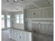 An unfinished living room featuring patio doors, a window, and ready for personalization at 2365 Zuni Road, St Cloud, FL 34771