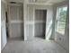 Bright, unfinished living room with a window offering great natural light and an open doorway under construction at 2365 Zuni Road, St Cloud, FL 34771