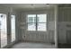 An unfinished living area with access to the outside through patio doors and a window at 2365 Zuni Road, St Cloud, FL 34771