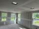 Bright, unfinished living room with multiple windows offering great natural light, still under construction at 2365 Zuni Road, St Cloud, FL 34771