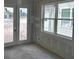 Bright room featuring glass patio doors and windows, ready for customization and decor at 2365 Zuni Road, St Cloud, FL 34771
