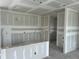 Living room showcasing unfinished walls, a window, and patio doors awaiting final customization at 2365 Zuni Road, St Cloud, FL 34771