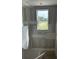 Unfinished staircase with a window bringing natural light, capturing the construction stage of the home at 2365 Zuni Road, St Cloud, FL 34771
