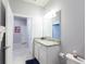 This bathroom features a granite vanity, toilet, and opens up into the bedroom at 271 Jetty Way, Davenport, FL 33897