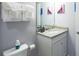 This bathroom features a granite vanity, toilet, and Disney's Frozen themed decor at 271 Jetty Way, Davenport, FL 33897