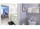 Bathroom features granite countertop vanity, toilet and is decorated with cartoon artwork at 271 Jetty Way, Davenport, FL 33897