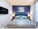 Comfortable bedroom features an accent wall and ambient lighting at 271 Jetty Way, Davenport, FL 33897