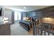 Cheerful Disney-themed bedroom featuring gray furnishings, crib and wood accent wall at 271 Jetty Way, Davenport, FL 33897