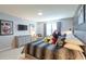 Charming Disney-themed bedroom with gray furnishings, a modern TV, and themed art at 271 Jetty Way, Davenport, FL 33897