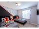 Mickey Mouse themed bedroom with twin beds and natural light at 271 Jetty Way, Davenport, FL 33897