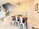 Elegant dining room with unique light fixture and eye-catching wall decor at 271 Jetty Way, Davenport, FL 33897