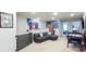 Bright game room with comfortable seating and various comic-themed decorations at 271 Jetty Way, Davenport, FL 33897