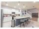 Beautiful open concept kitchen with a large granite island and bar stool seating at 271 Jetty Way, Davenport, FL 33897
