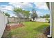 Large grassy backyard, complete with a garden bed and privacy fence, great for outdoor entertaining at 2850 Pewter Mist Ct, Oviedo, FL 32765