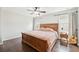 Bedroom featuring a wooden sleigh bed and matching nightstands, with hardwood floors at 2850 Pewter Mist Ct, Oviedo, FL 32765