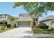 Beautiful two-story home with a well-manicured lawn and inviting two-car garage at 2850 Pewter Mist Ct, Oviedo, FL 32765